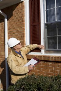 Home inspector performing inspection