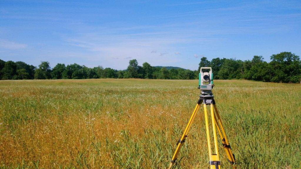 surveying a field banner